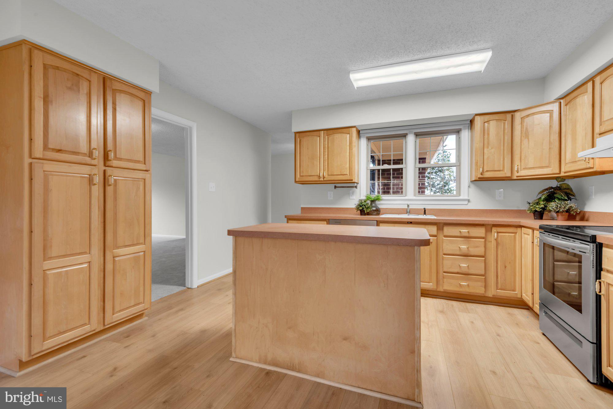 2572 Golfers Ridge Road Annapolis, MD 21401 - Photo 28 of 69 a kitchen with stainless steel appliances granite countertop a refrigerator sink and cabinets