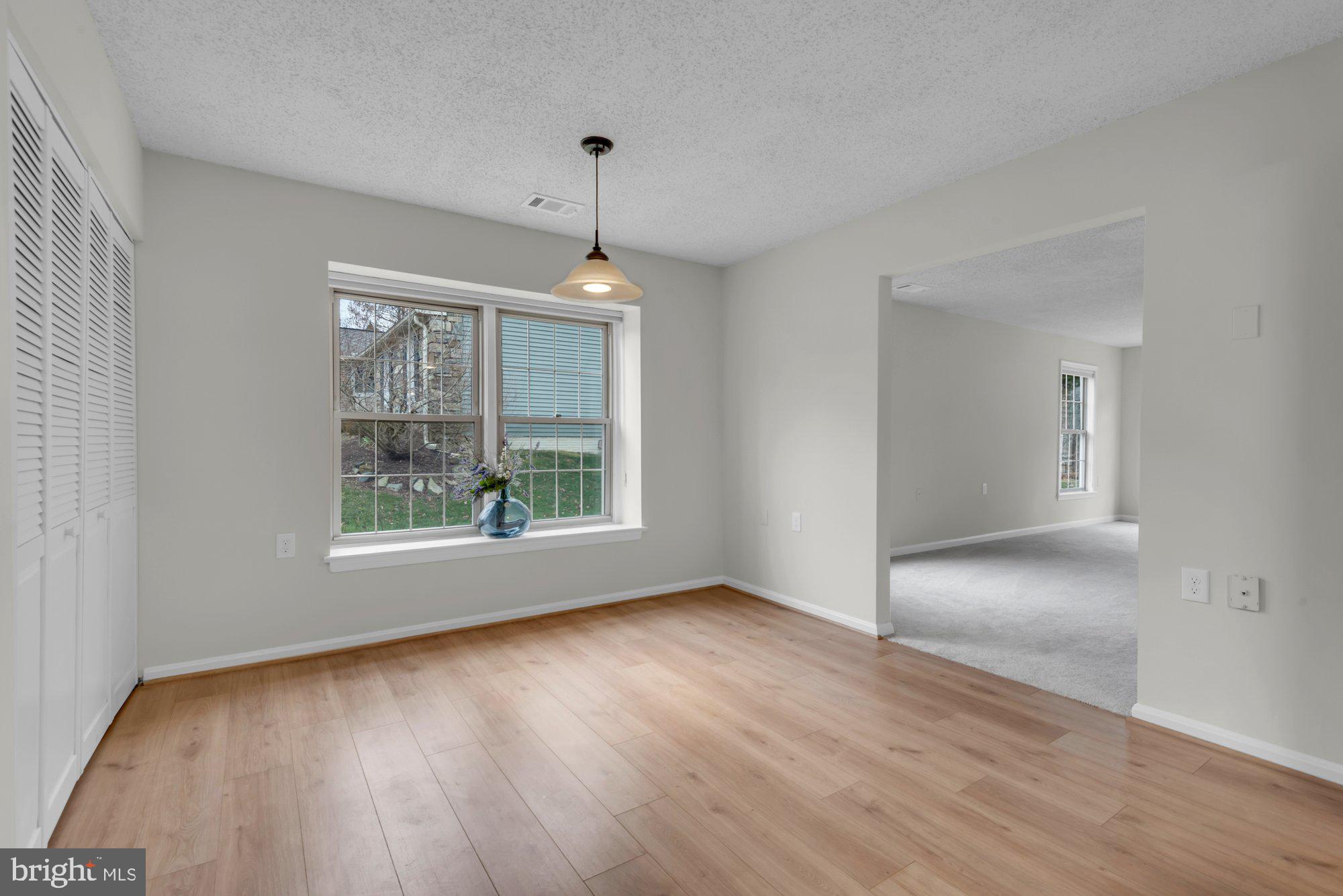 2572 Golfers Ridge Road Annapolis, MD 21401 - Photo 30 of 69 a view of an empty room with wooden floor and a window
