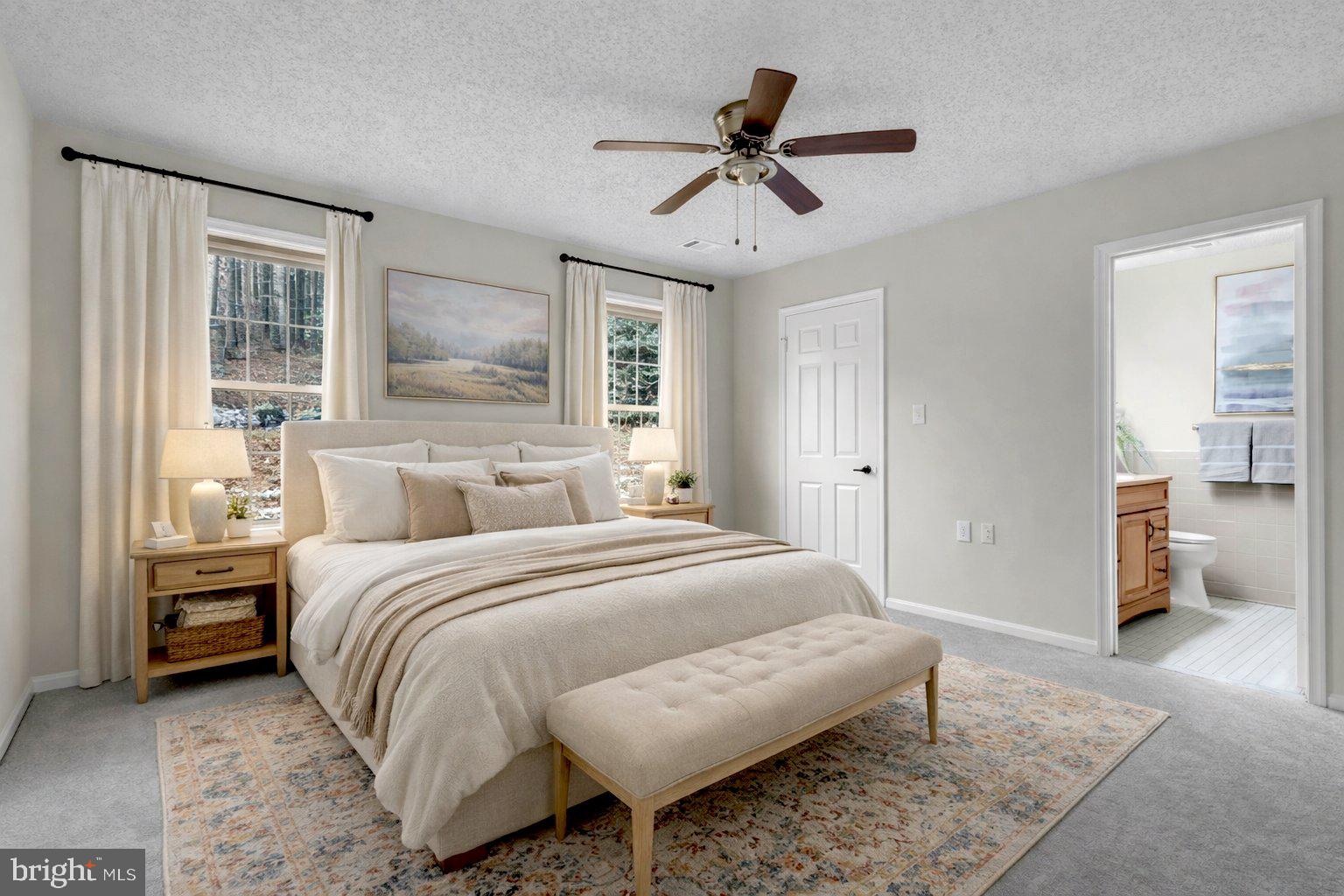 2572 Golfers Ridge Road Annapolis, MD 21401 - Photo 31 of 69 a bedroom with a bed and a chandelier