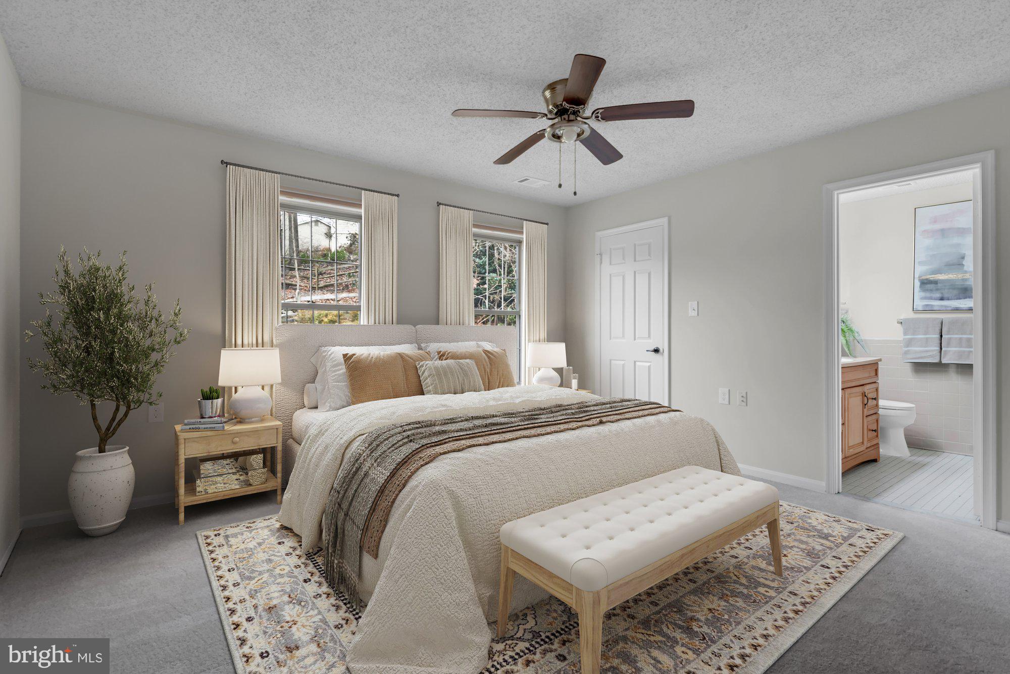 2572 Golfers Ridge Road Annapolis, MD 21401 - Photo 34 of 69 a bedroom with a bed and a chandelier