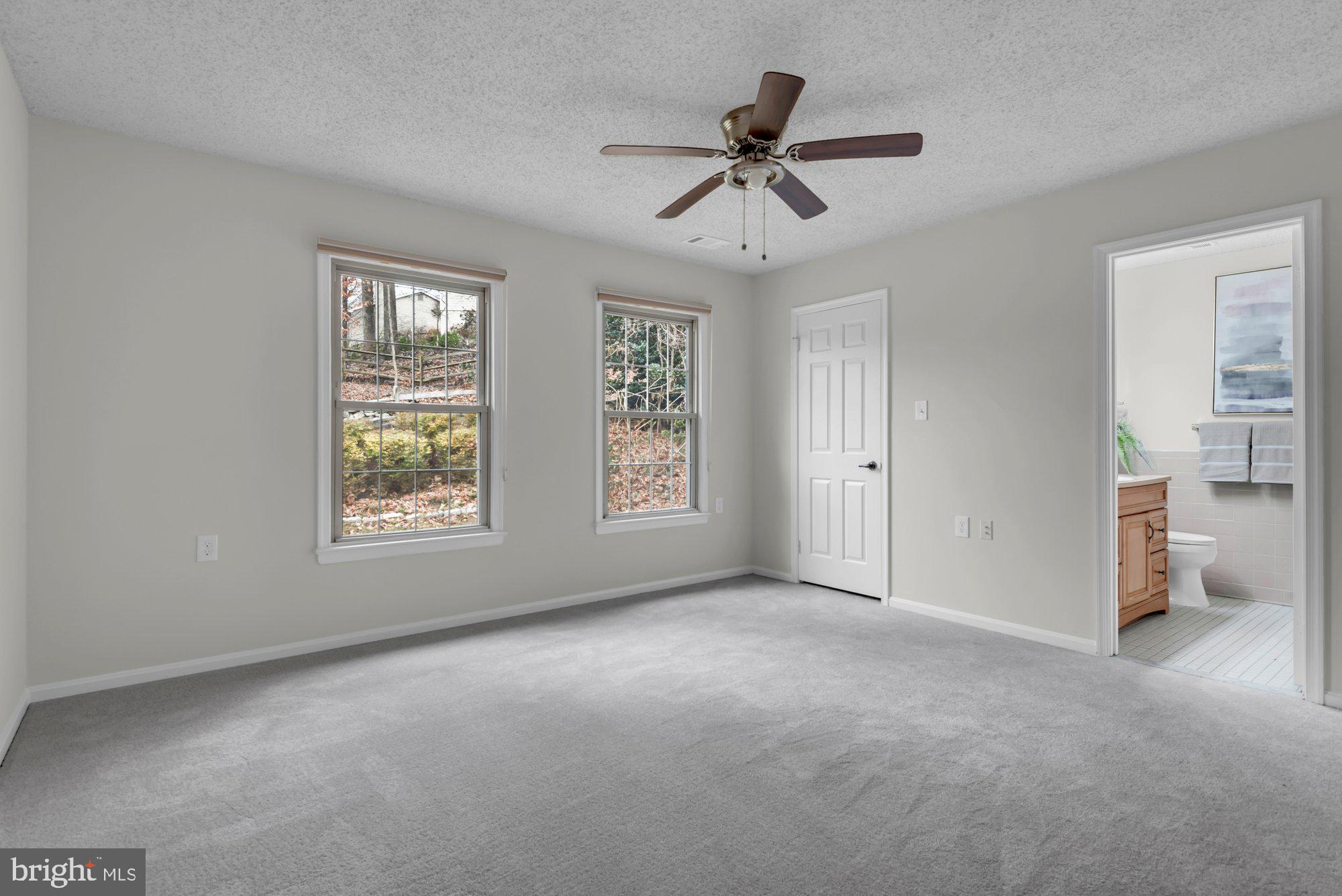 2572 Golfers Ridge Road Annapolis, MD 21401 - Photo 40 of 69 a view of a livingroom with a window and a ceiling fan
