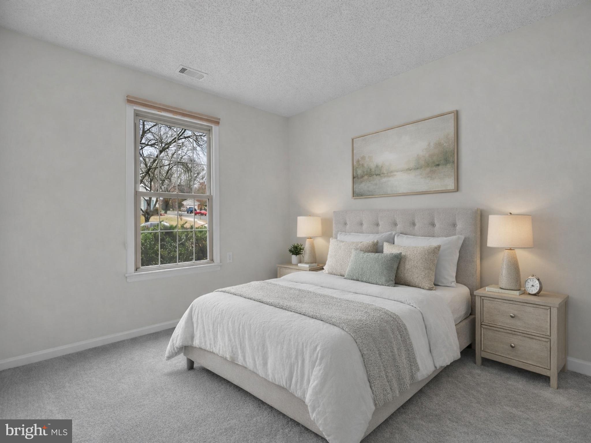 2572 Golfers Ridge Road Annapolis, MD 21401 - Photo 42 of 69 a bedroom with a bed and a painting on the wall