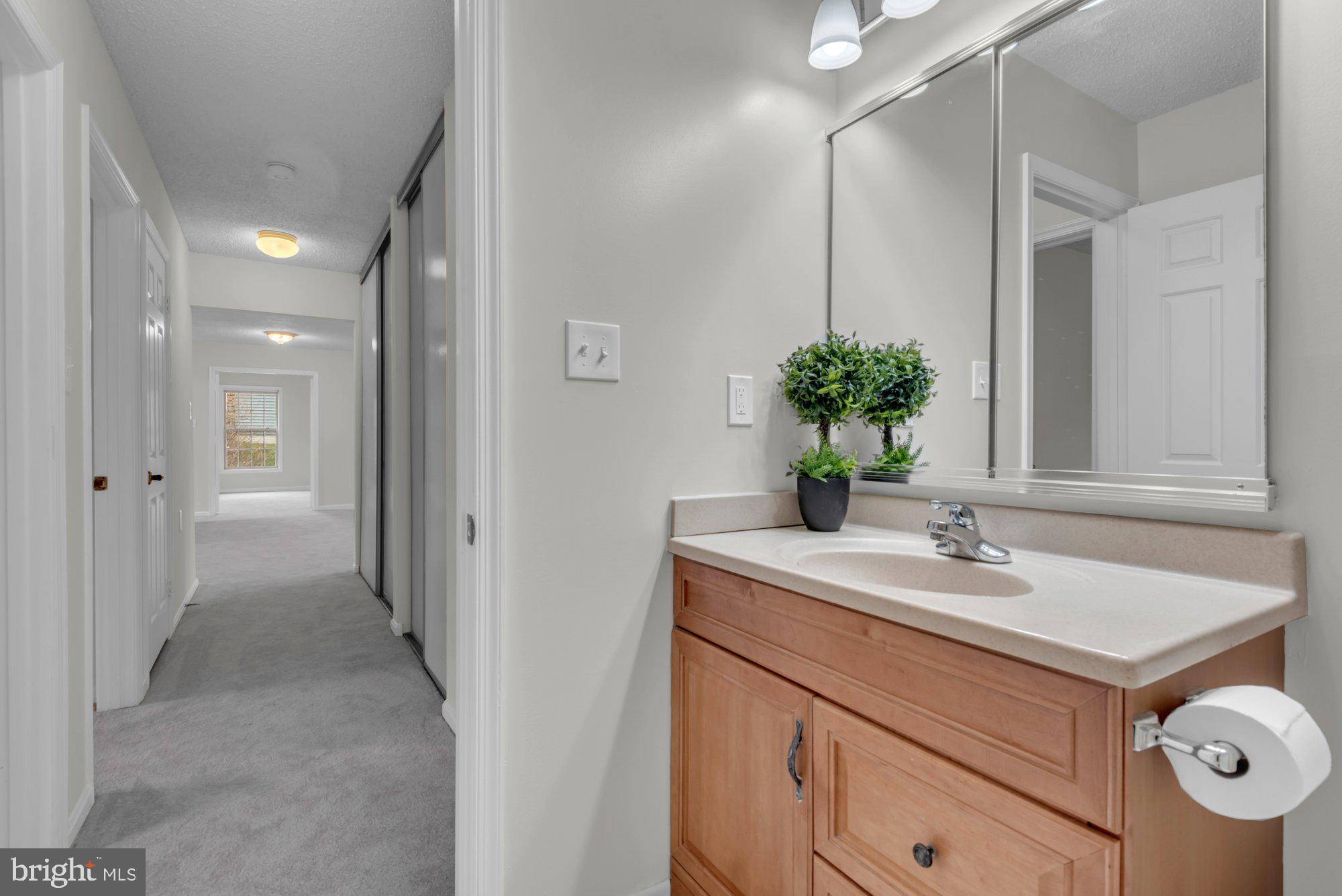2572 Golfers Ridge Road Annapolis, MD 21401 - Photo 45 of 69 a bathroom with a sink and a mirror