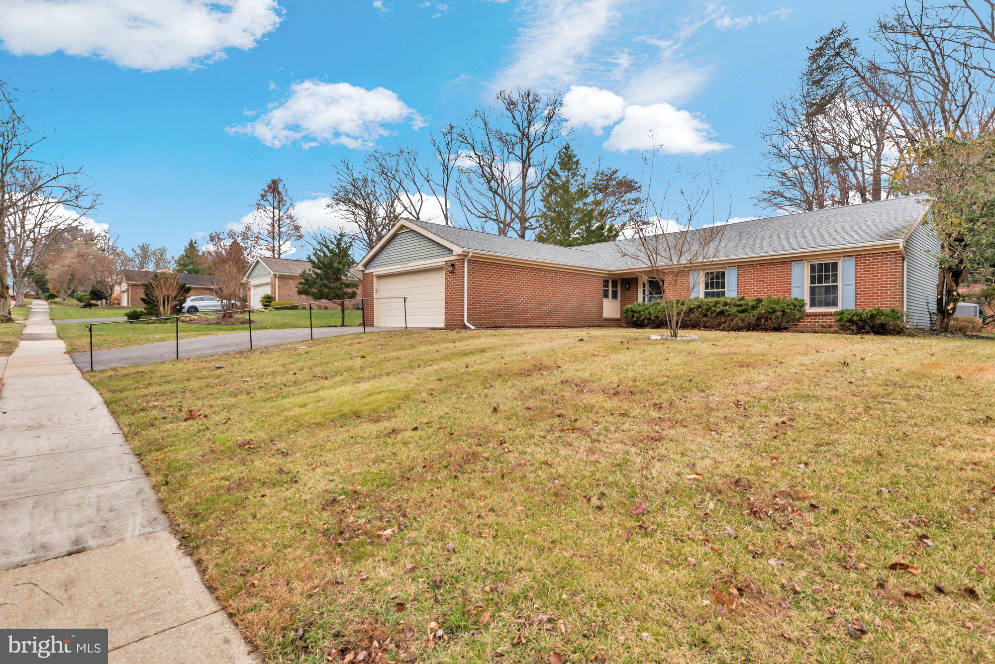 2572 Golfers Ridge Road Annapolis, MD 21401 - Photo 49 of 69 a yellow house with trees in front of it