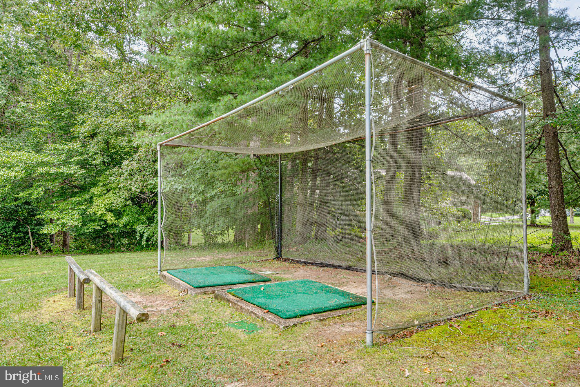 2572 Golfers Ridge Road Annapolis, MD 21401 - Photo 60 of 69 a backyard of a house with a garden and deck