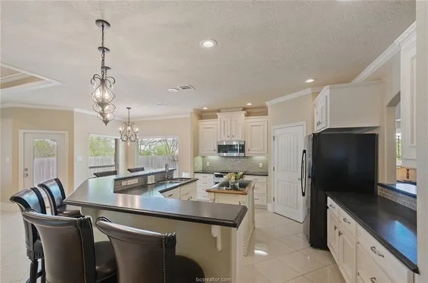 a kitchen with counter space cabinets and appliances