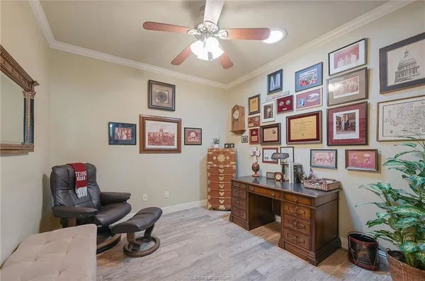 a view of a workspace with a bookshelf