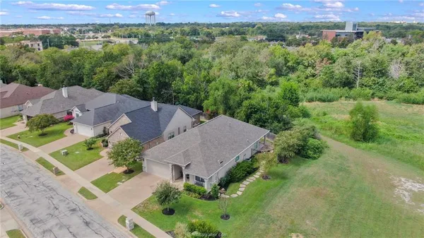 an aerial view of a house with a garden