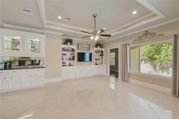 a large kitchen with stainless steel appliances granite countertop a sink and cabinets
