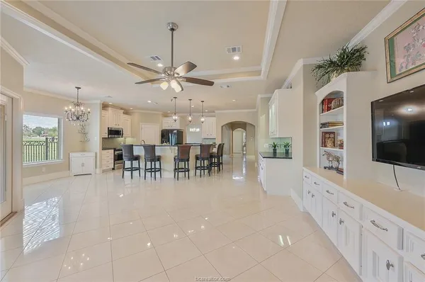 a view of a livingroom with furniture and a flat screen tv