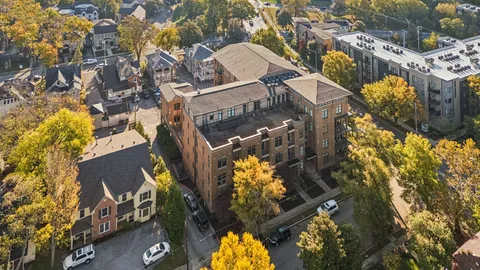 an aerial view of residential houses with outdoor space