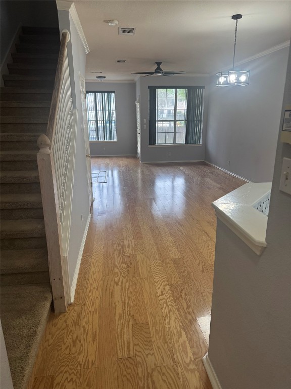 wooden floor in an empty room with windows