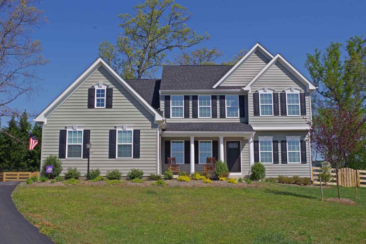 184 Ridgemont Road Ruckersville, VA 22968 - Photo 1 of 50 a front view of a house with a yard