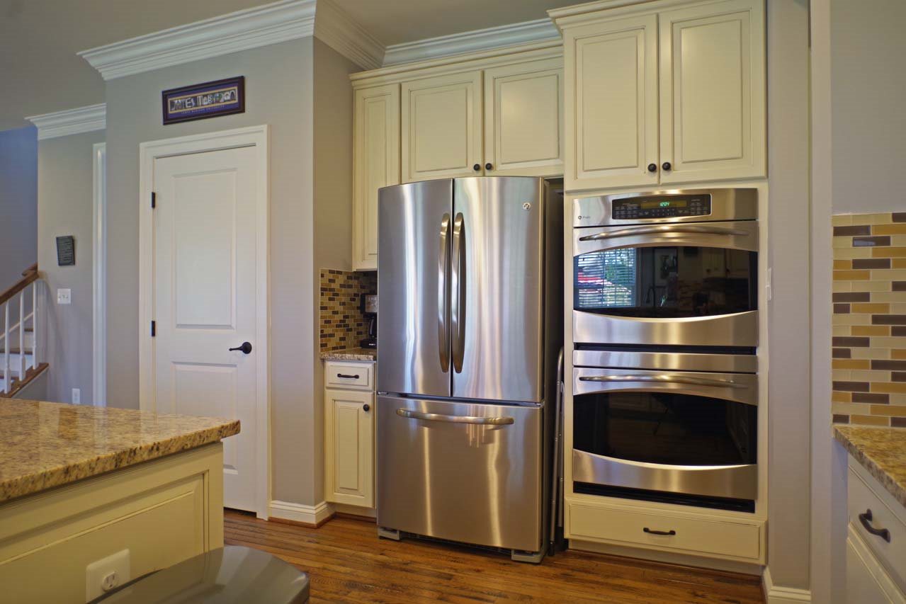 184 Ridgemont Road Ruckersville, VA 22968 - Photo 13 of 50 a kitchen with a refrigerator and white cabinets