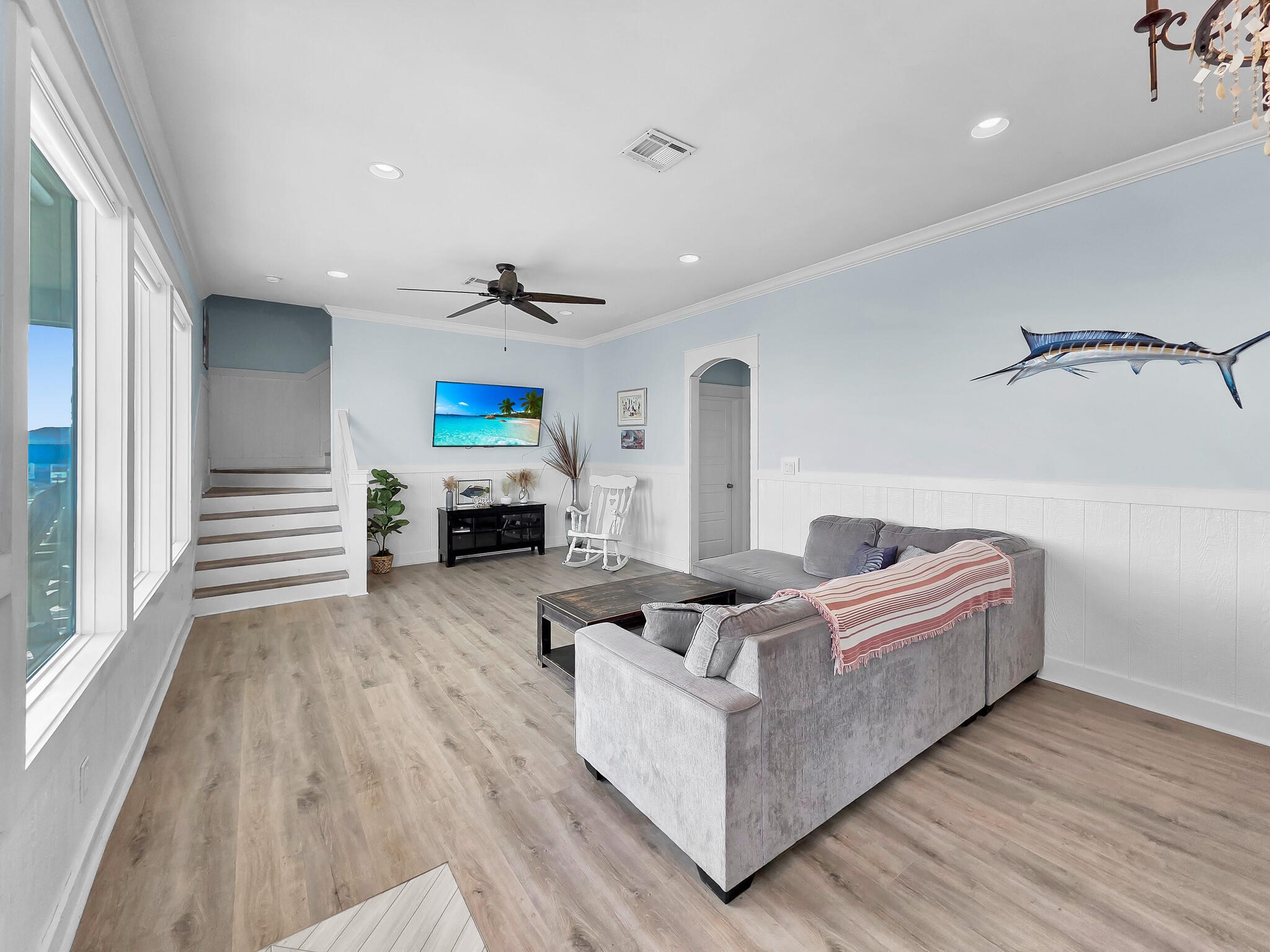 816 South Crystal Beach Road Crystal Beach, TX 77650 - Photo 11 of 48 a living room with furniture and a wooden floor