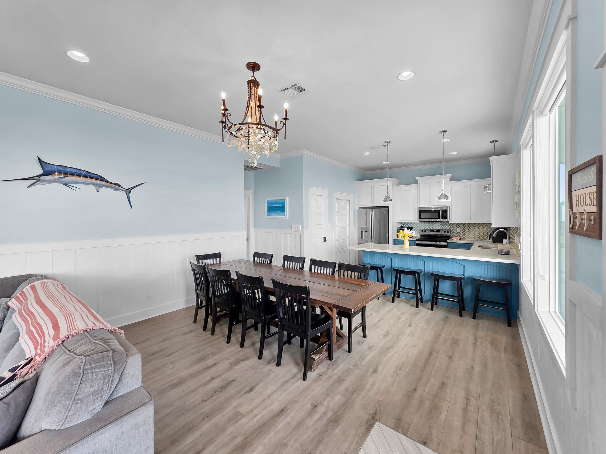 816 South Crystal Beach Road Crystal Beach, TX 77650 - Photo 16 of 48 a view of a dining room with furniture and wooden floor