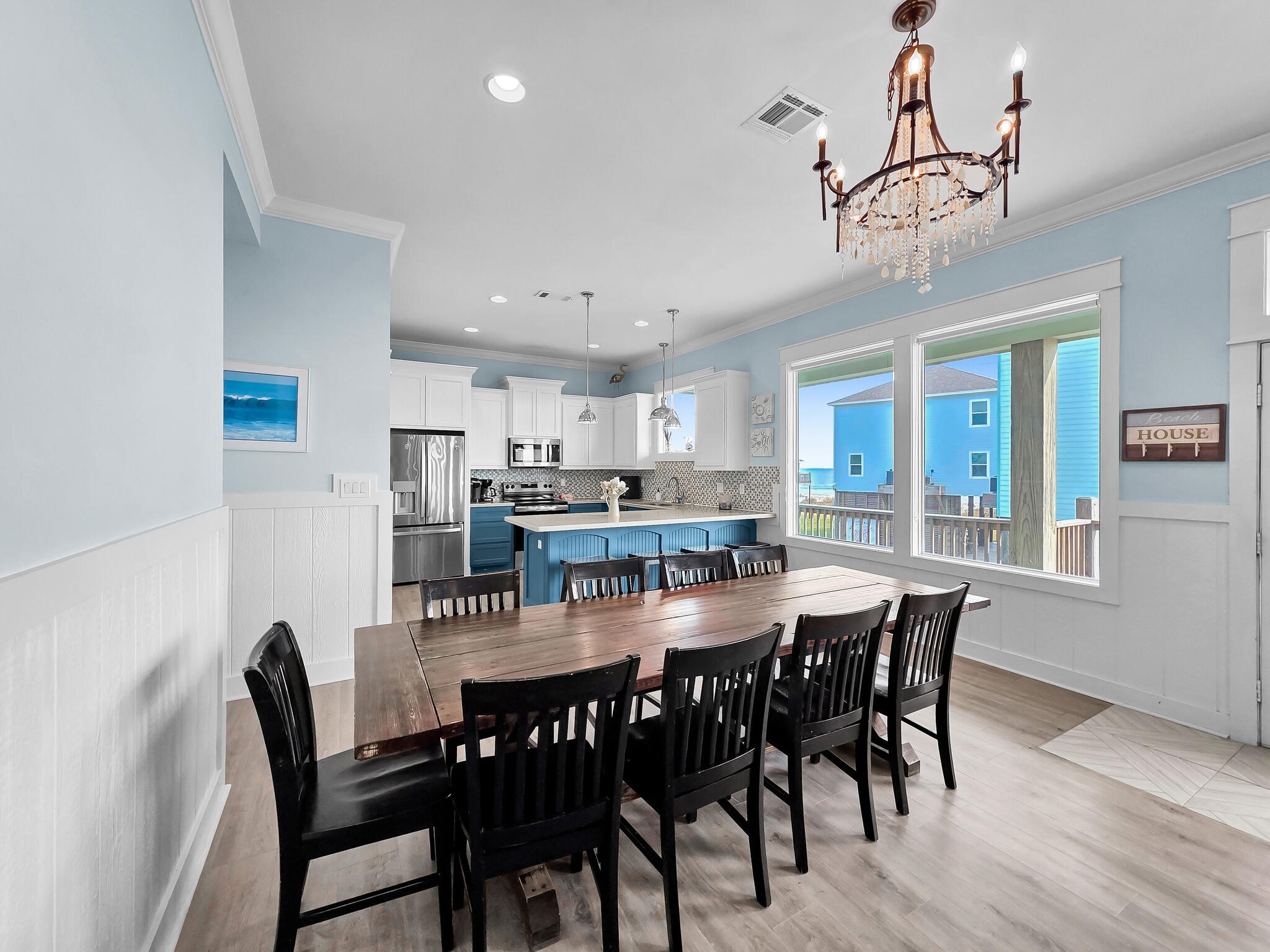 816 South Crystal Beach Road Crystal Beach, TX 77650 - Photo 18 of 48 a view of a dining room with furniture window and wooden floor