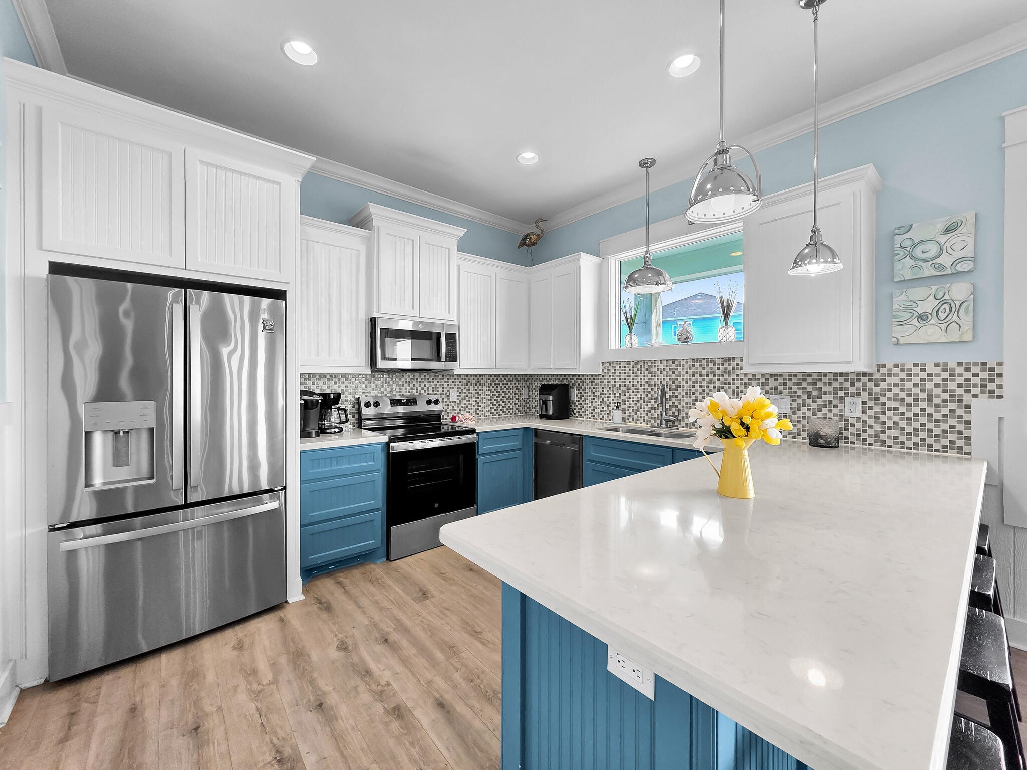 816 South Crystal Beach Road Crystal Beach, TX 77650 - Photo 22 of 48 a kitchen with granite countertop a refrigerator and a stove top oven