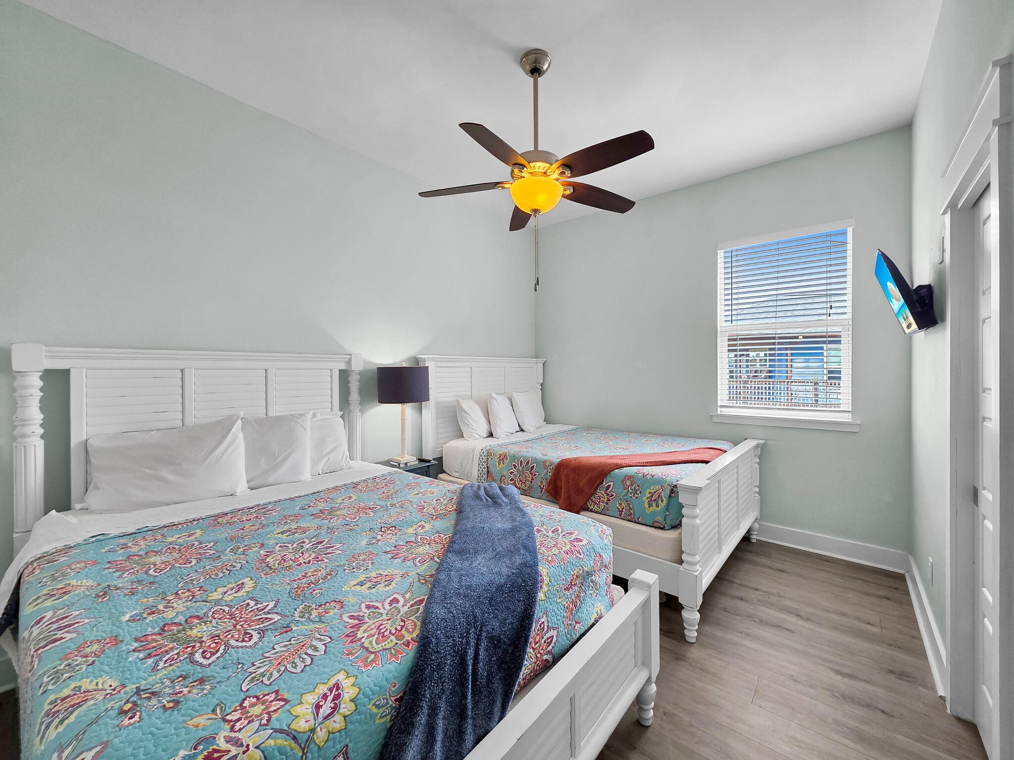 816 South Crystal Beach Road Crystal Beach, TX 77650 - Photo 24 of 48 a bedroom with a bed and wooden floor