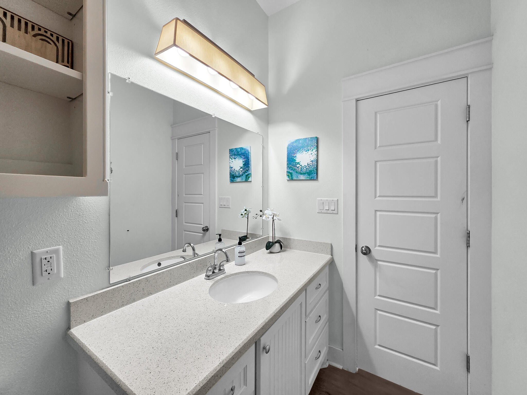 816 South Crystal Beach Road Crystal Beach, TX 77650 - Photo 26 of 48 a bathroom with a sink a vanity and a mirror