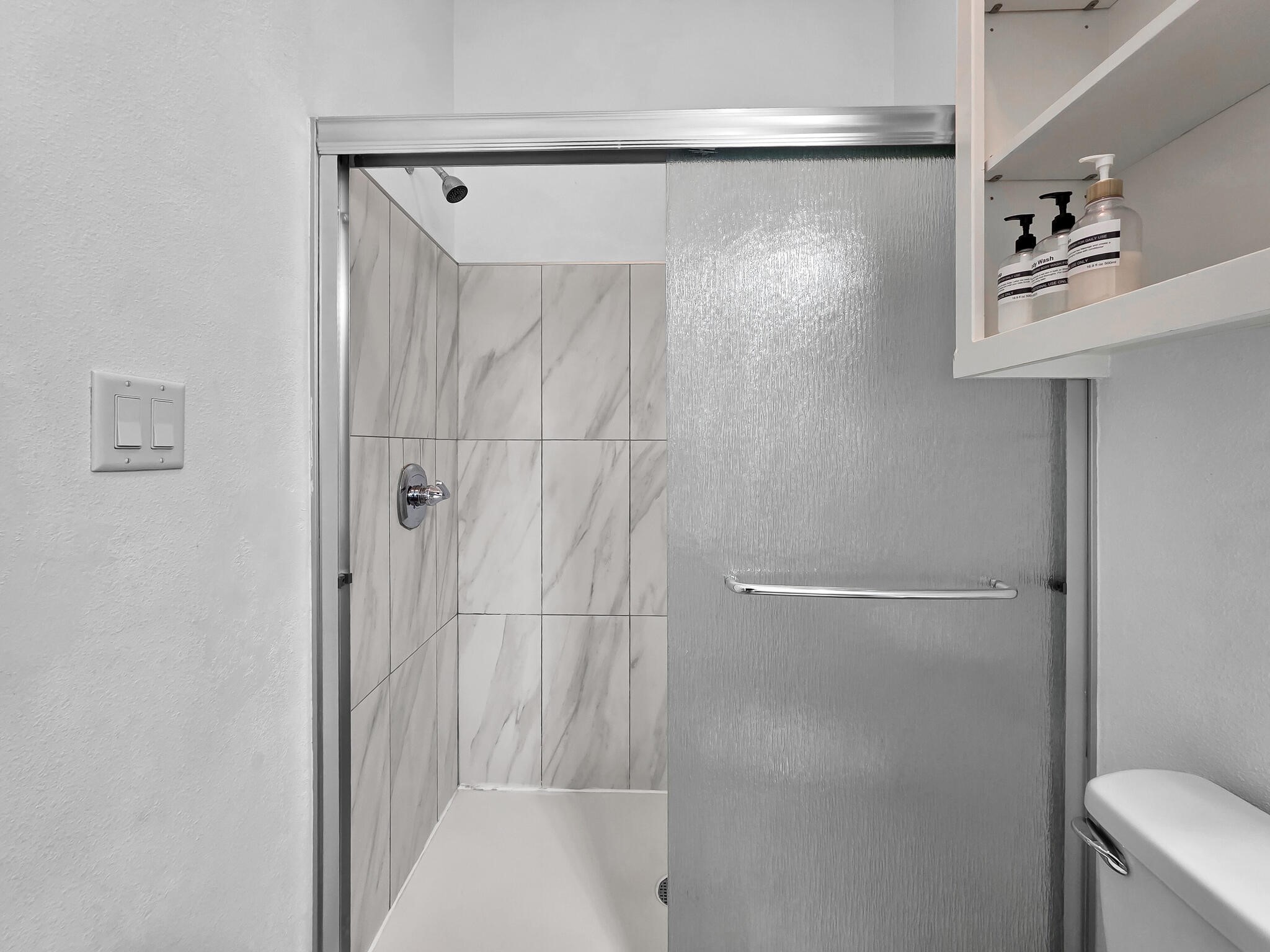 816 South Crystal Beach Road Crystal Beach, TX 77650 - Photo 28 of 48 a bathroom with a shower and a toilet