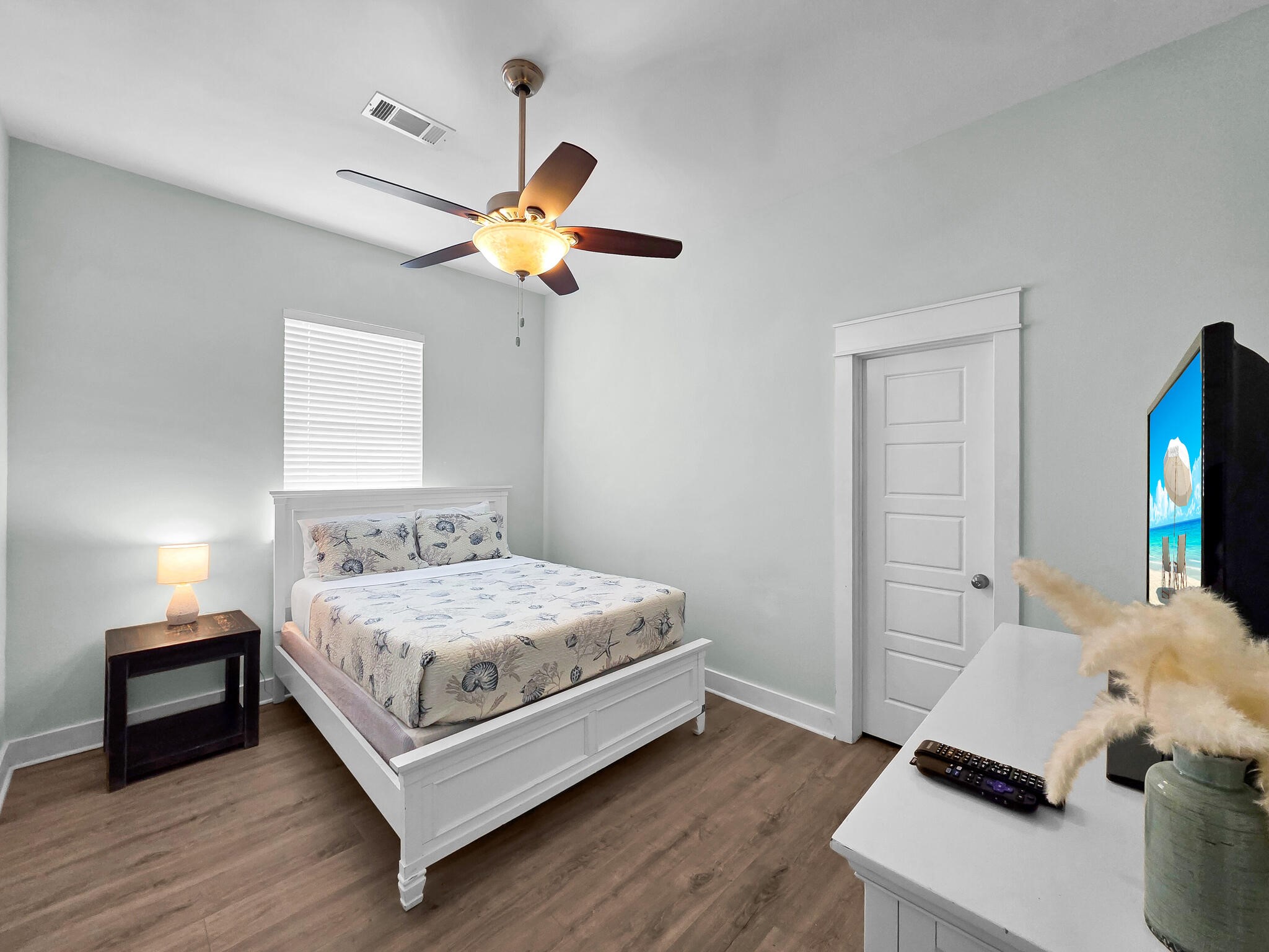 816 South Crystal Beach Road Crystal Beach, TX 77650 - Photo 29 of 48 a bedroom with a bed and a chandelier