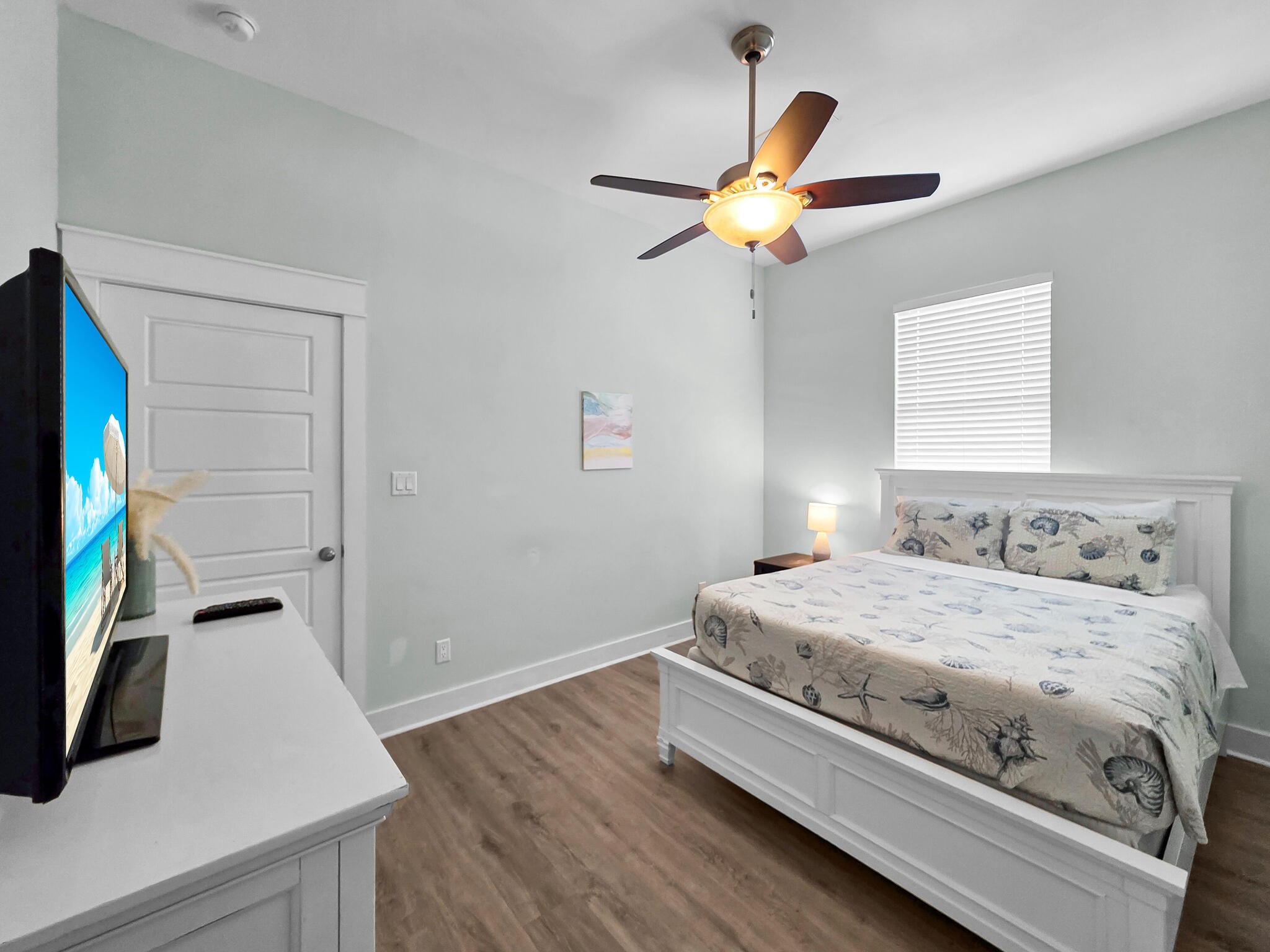 816 South Crystal Beach Road Crystal Beach, TX 77650 - Photo 30 of 48 a bedroom with a bed and a flat screen tv