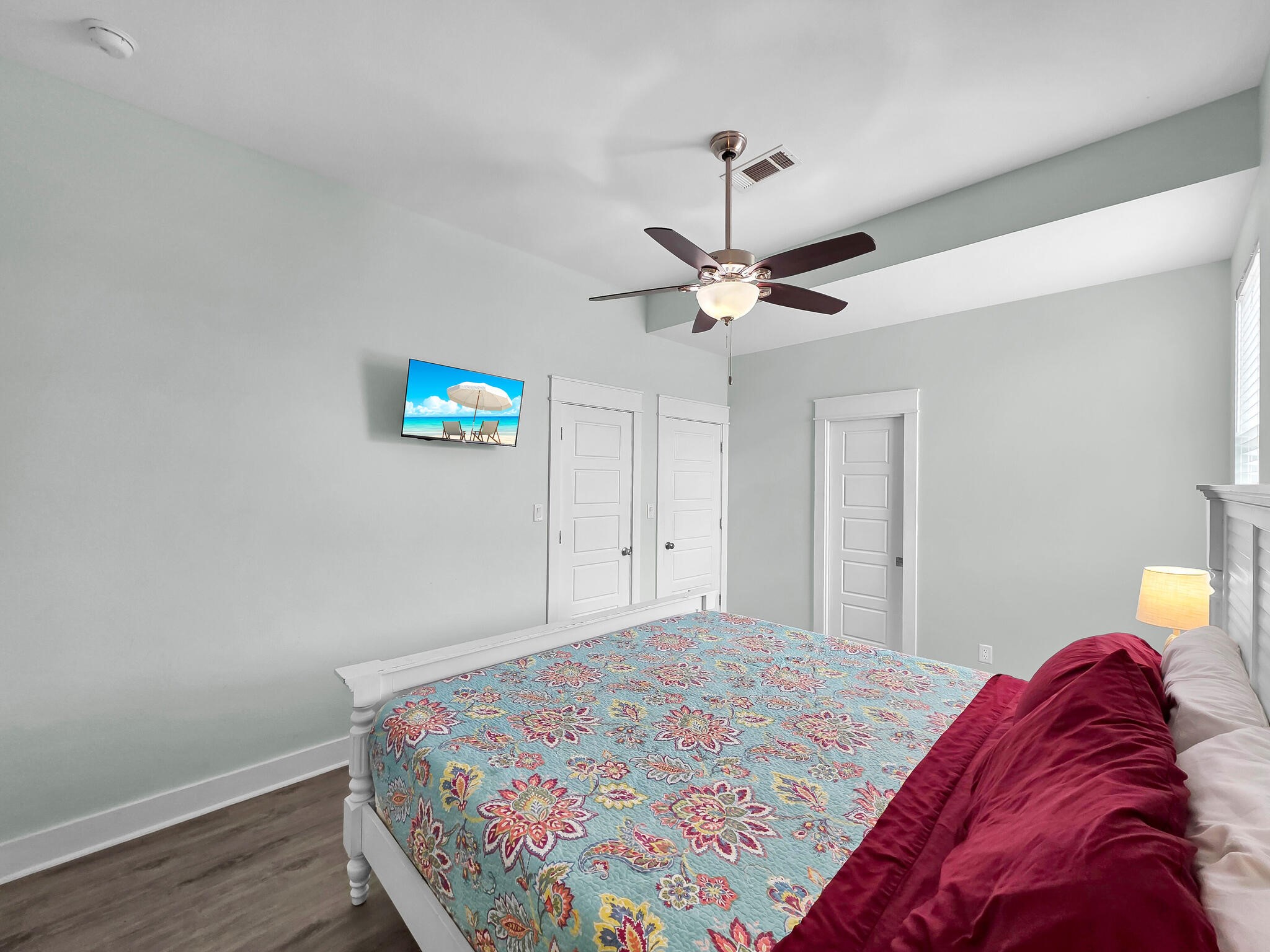 816 South Crystal Beach Road Crystal Beach, TX 77650 - Photo 34 of 48 a bedroom with a bed and a chandelier