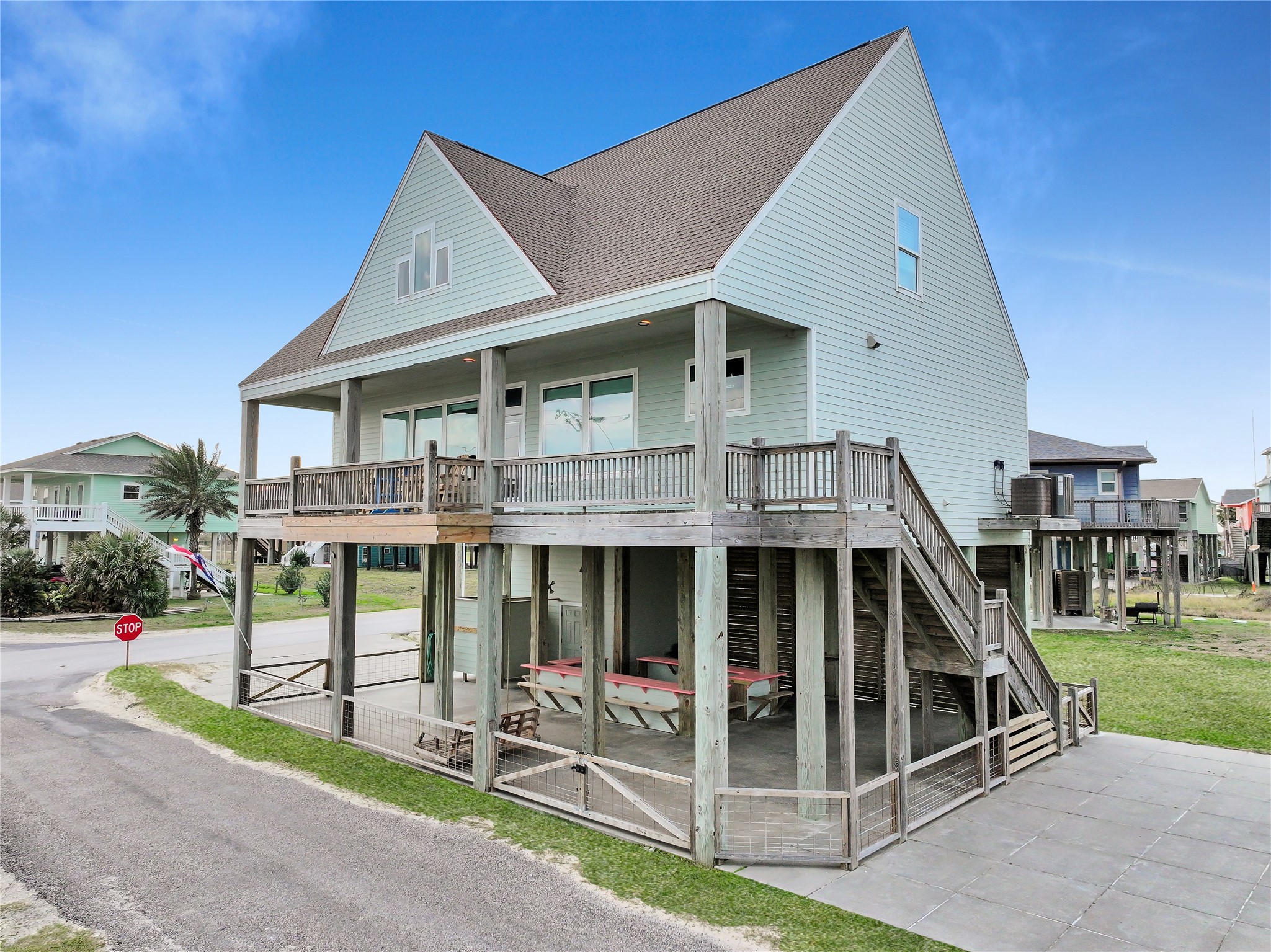 816 South Crystal Beach Road Crystal Beach, TX 77650 - Photo 4 of 48 a view of a house with a yard and balcony