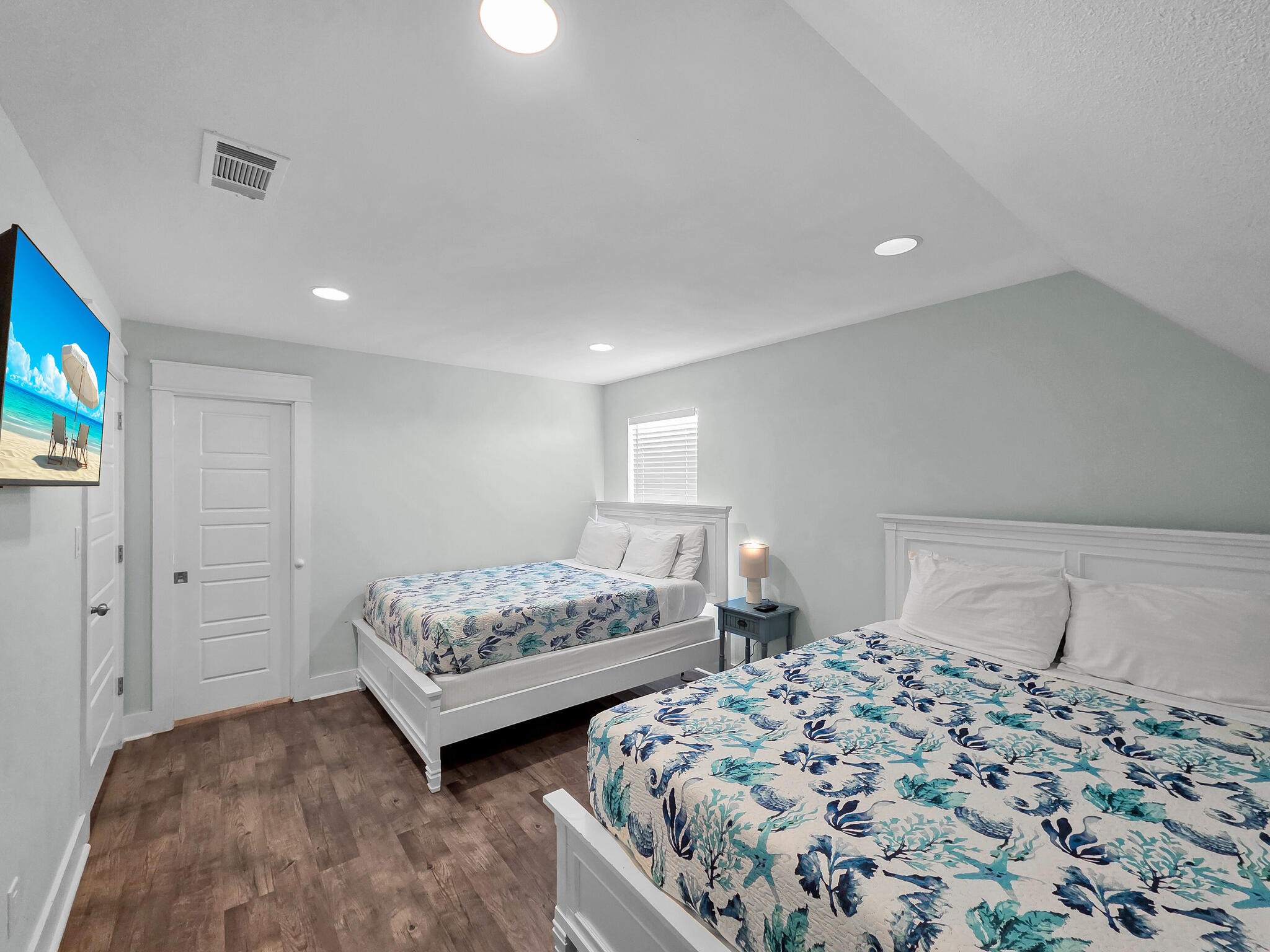 816 South Crystal Beach Road Crystal Beach, TX 77650 - Photo 44 of 48 a bedroom with two beds and a tv