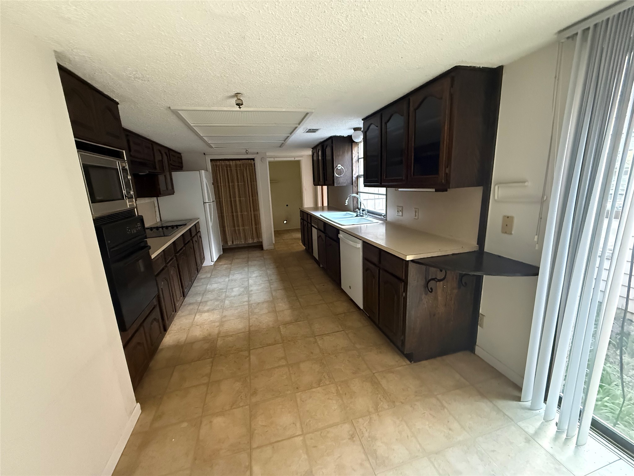 254 Lone Star Road Bastrop, TX 78602 - Photo 7 of 20 Functional kitchen with generous cabinet and counter space.