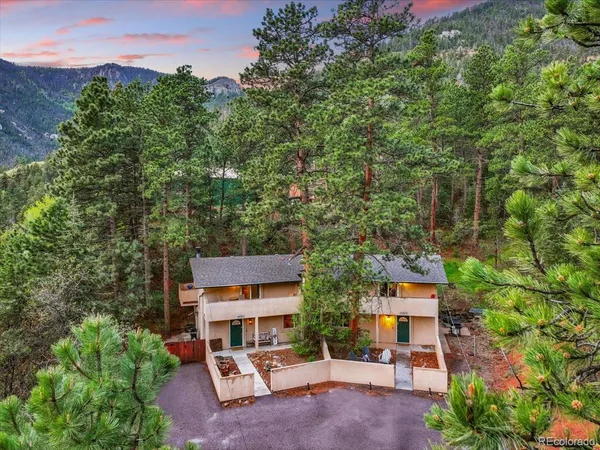 an aerial view of a house with roof deck