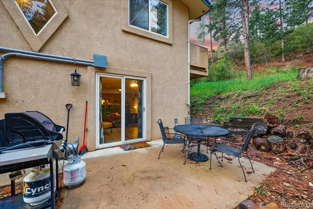 a backyard of a house with yard and outdoor seating