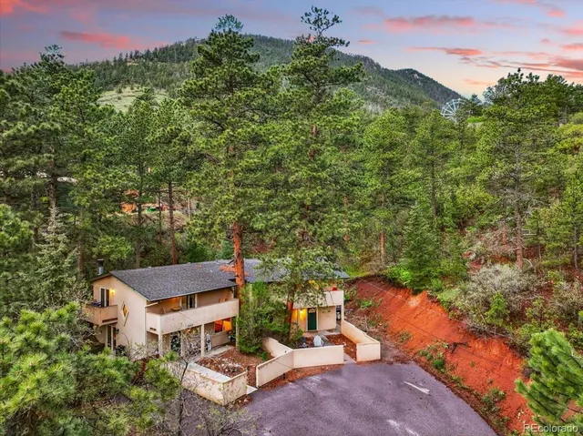 a aerial view of a house with a yard