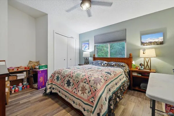 a kitchen with a sink a stove cabinets and a window