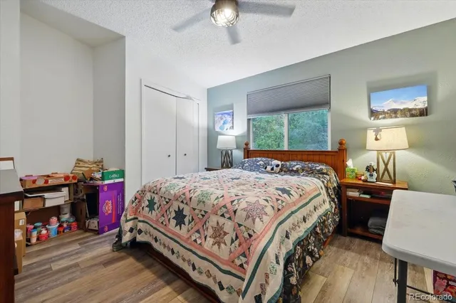 a kitchen with a sink a stove cabinets and a window