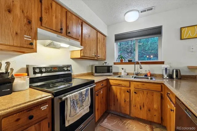 a backyard of a house with table and chairs