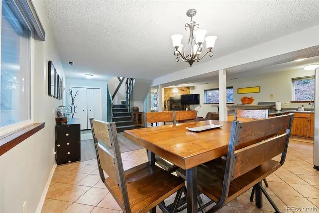 a view of a livingroom with furniture and stairs