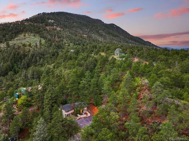 a aerial view of a house with a yard