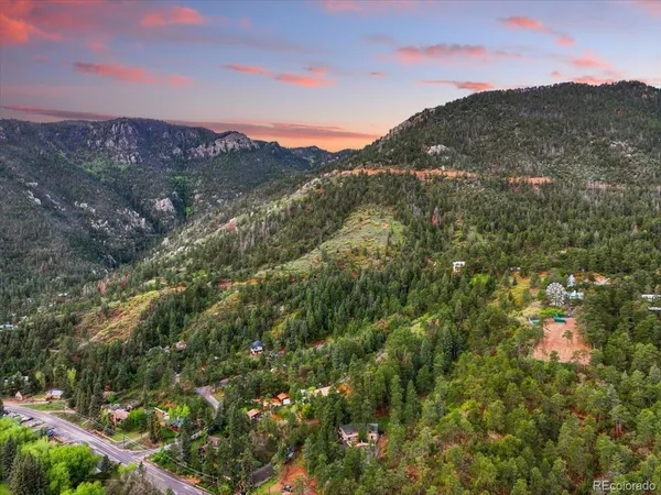 a view of a city with mountains in the background