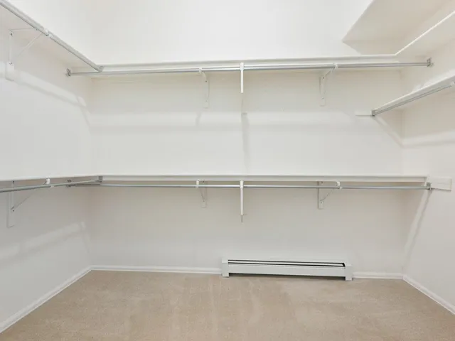 a view of an empty walk in closet