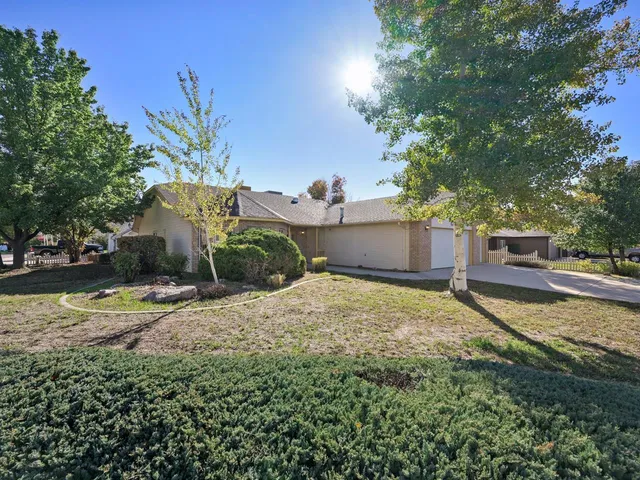 a view of garage and yard