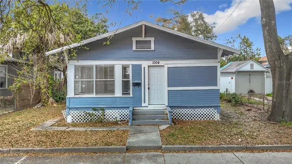 a front view of a house with garage