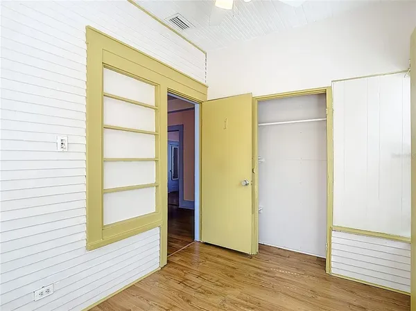 a white toilet sitting next to a shower curtain