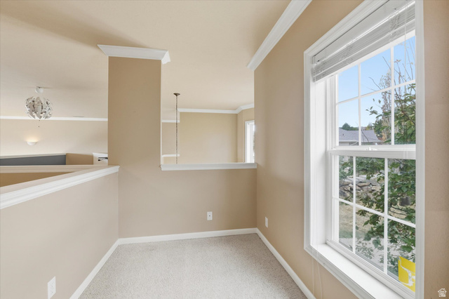 2887 View Crest Circle North Logan, UT 84341 - Photo 16 of 37 Hallway featuring crown molding and light carpet