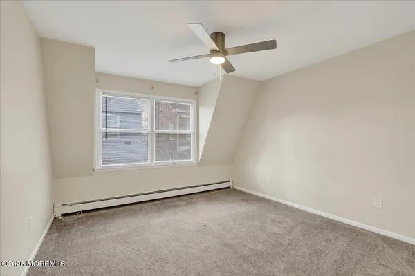 an empty room with a empty space and windows