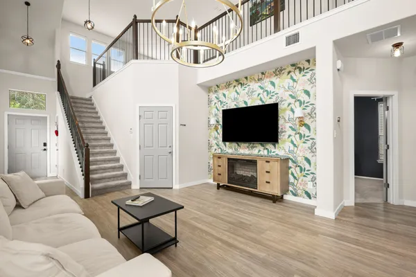 a living room with furniture and a flat screen tv