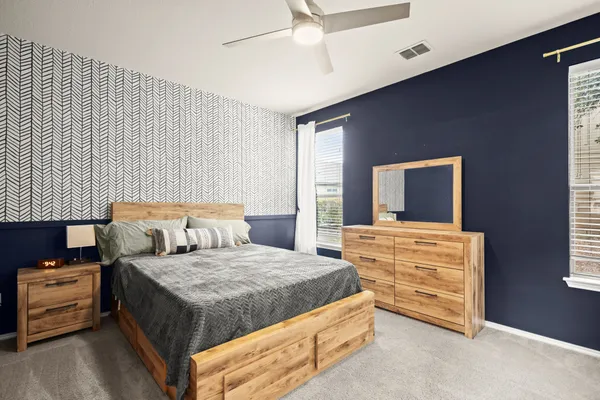 a bedroom with bed and window