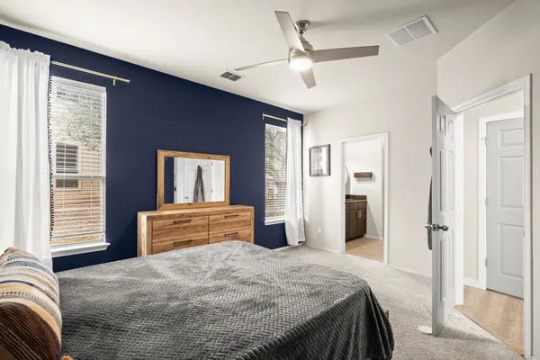 a bedroom with a bed and a dresser