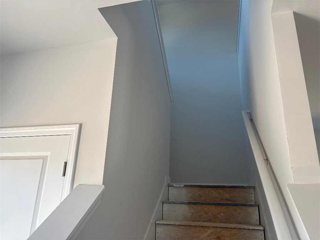 129 Cedar Shoals Easley, SC 29640 - Photo 10 of 31 Ascend to comfort with unfinished wooden stairs leading to an upper level.
